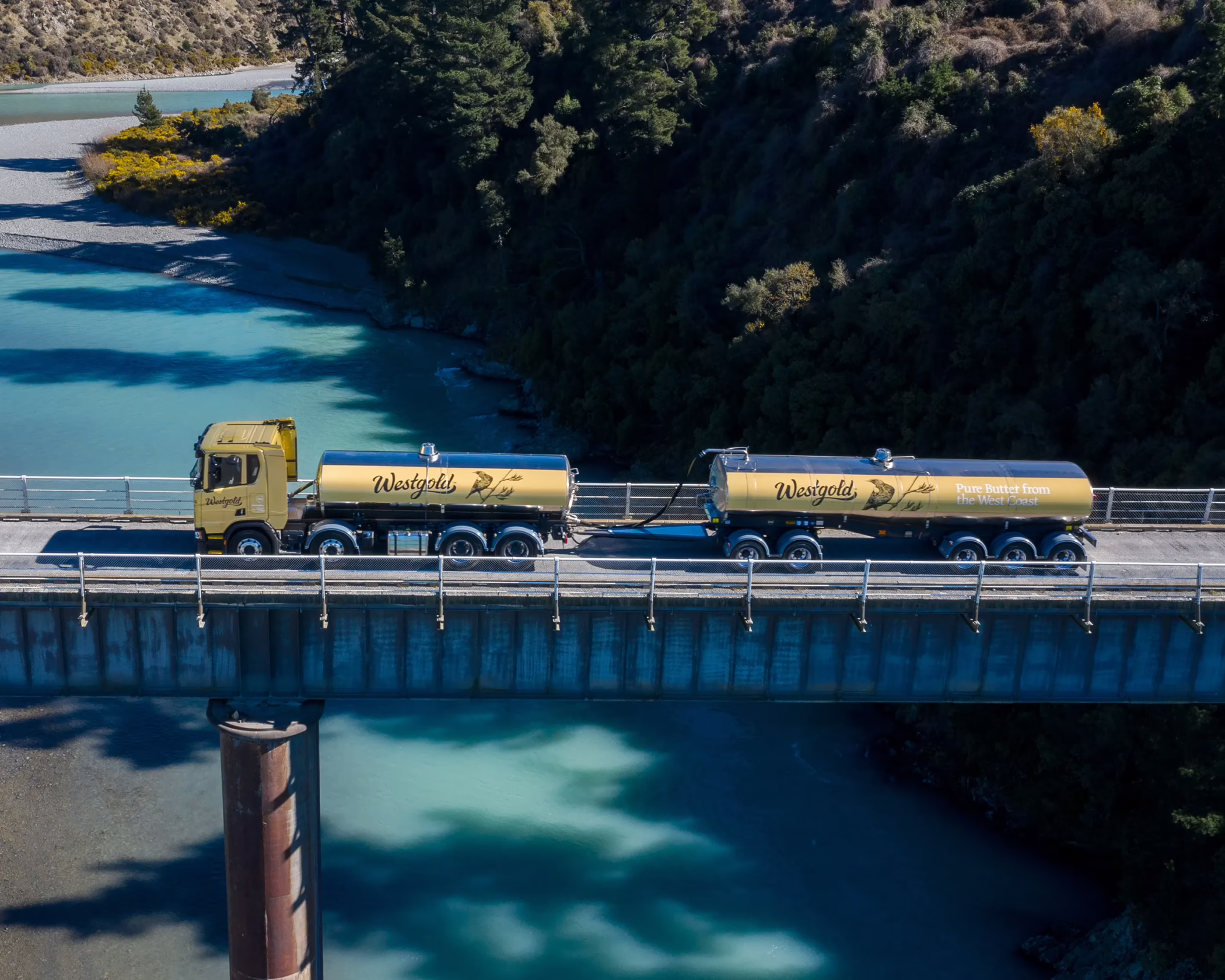 Custom Westgold milk tanker vehicle wrap by Timaru Signs Graphix, featuring detailed livery and branding on a concrete bridge.