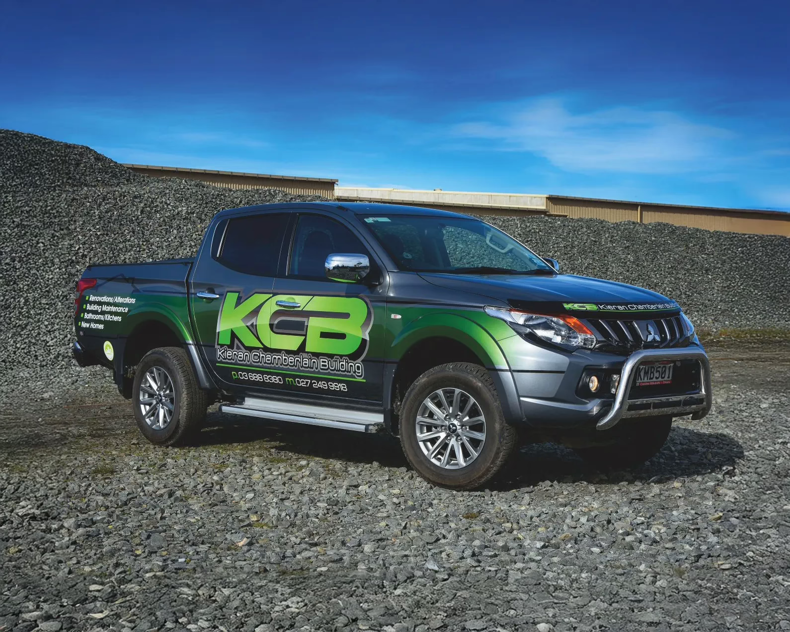 Full Mitsubishi Triton vehicle wrap for KCB Kieran Chamberlain Building in Timaru, featuring green and charcoal graphics.