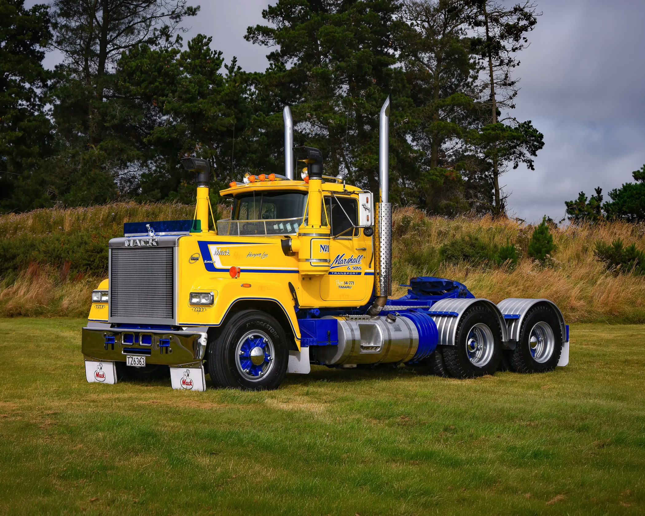 Full custom commercial vehicle wrap for Marshall & Sons Transport by Timaru Signs, featuring a yellow, blue, and chrome Mack truck.