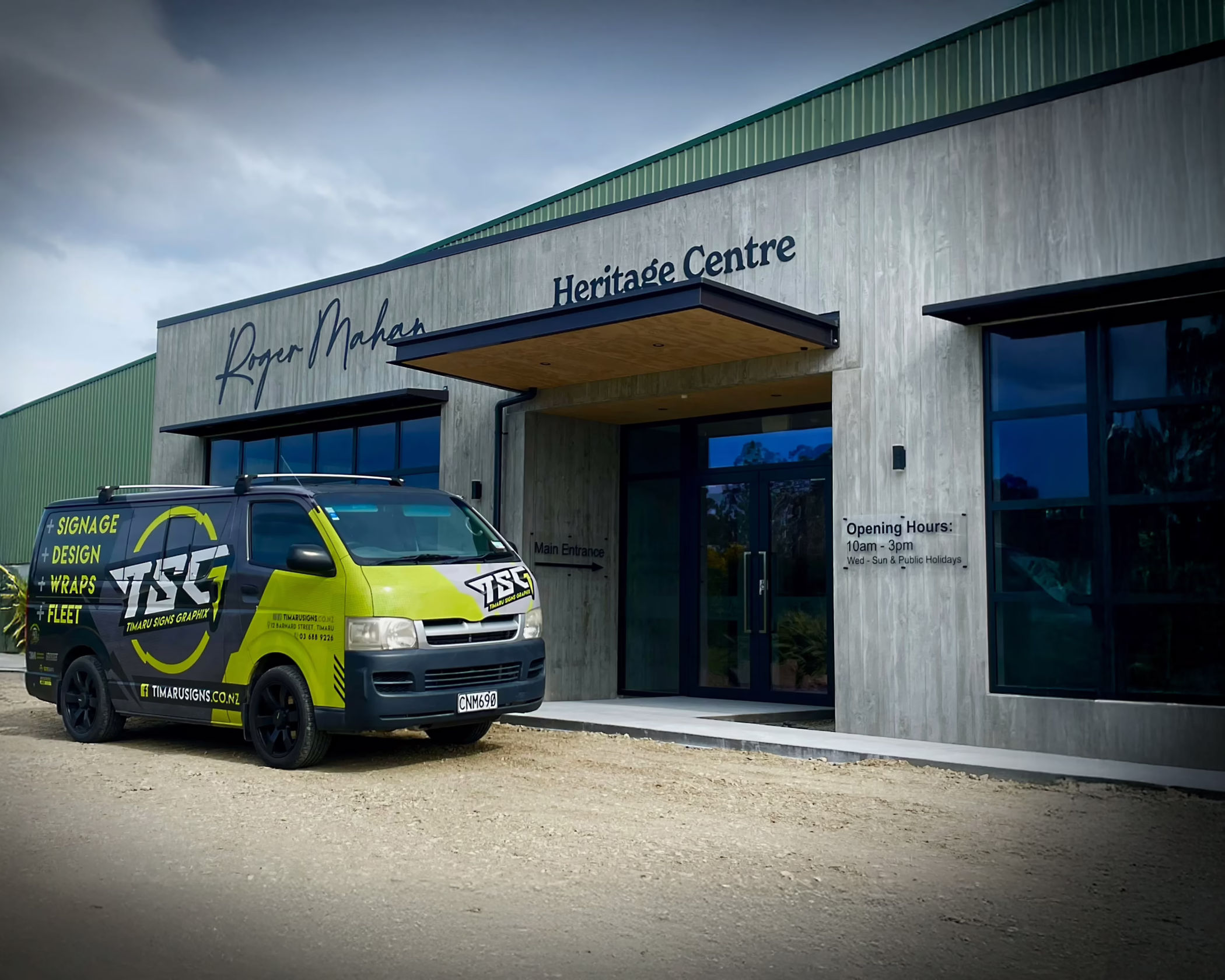 Exterior signs for Roger Mahan Heritage Centre.