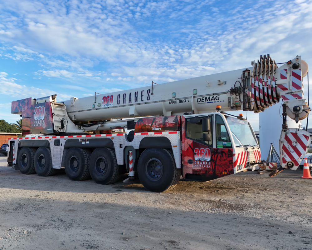 Full commercial crane wrap by Timaru Signs, featuring red, black, and grey Demag and 360 Cranes branding.