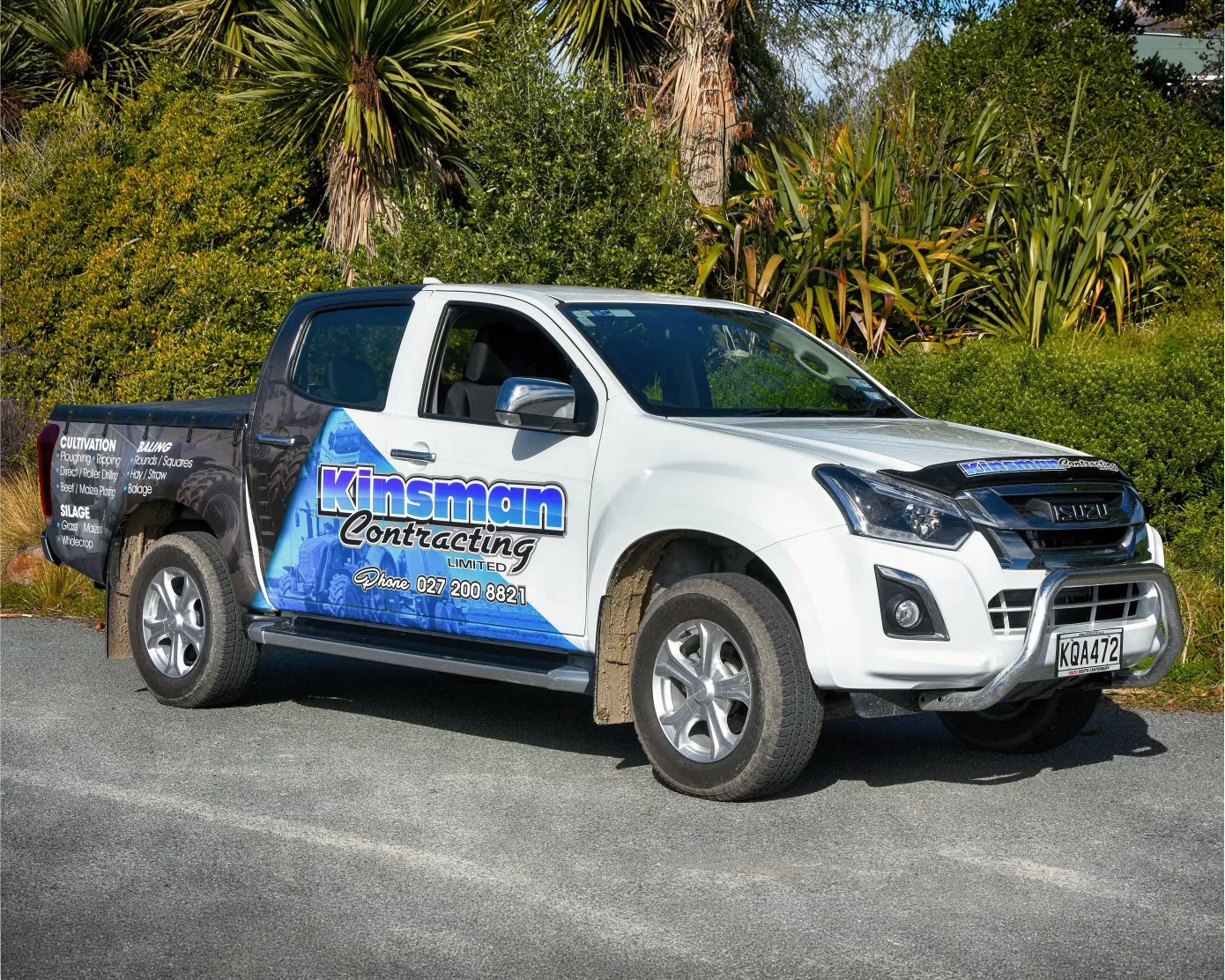 Kinsman Contracting custom Isuzu D-Max vehicle wrap featuring blue and white design, contact details, and services list by Timaru Signs.