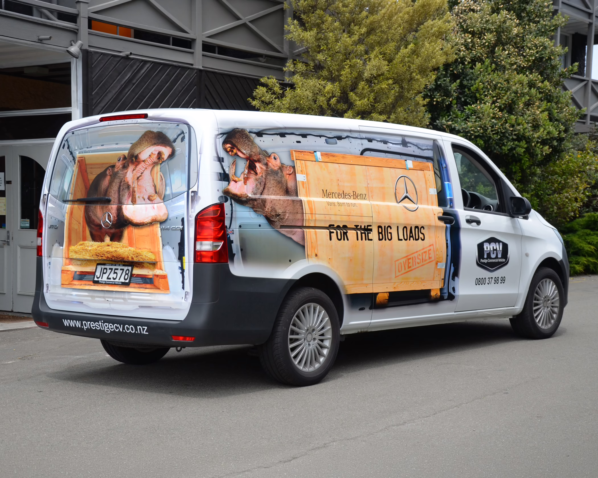 Custom vehicle wrap on a Mercedes van for Prestige Commercial Vehicles, featuring a hippo in a crate graphic.