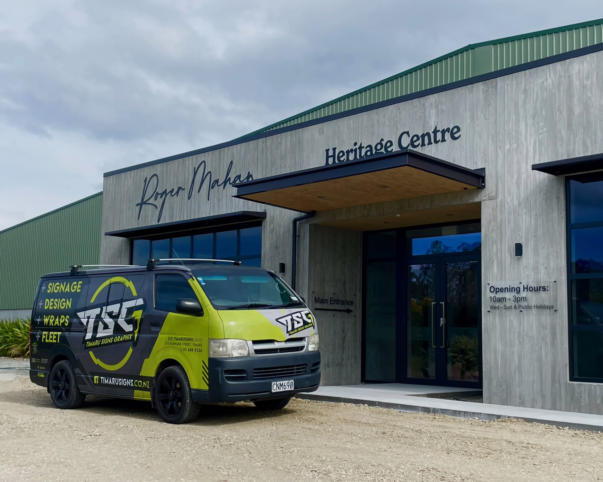 Exterior signs for Roger Mahan Heritage Centre.