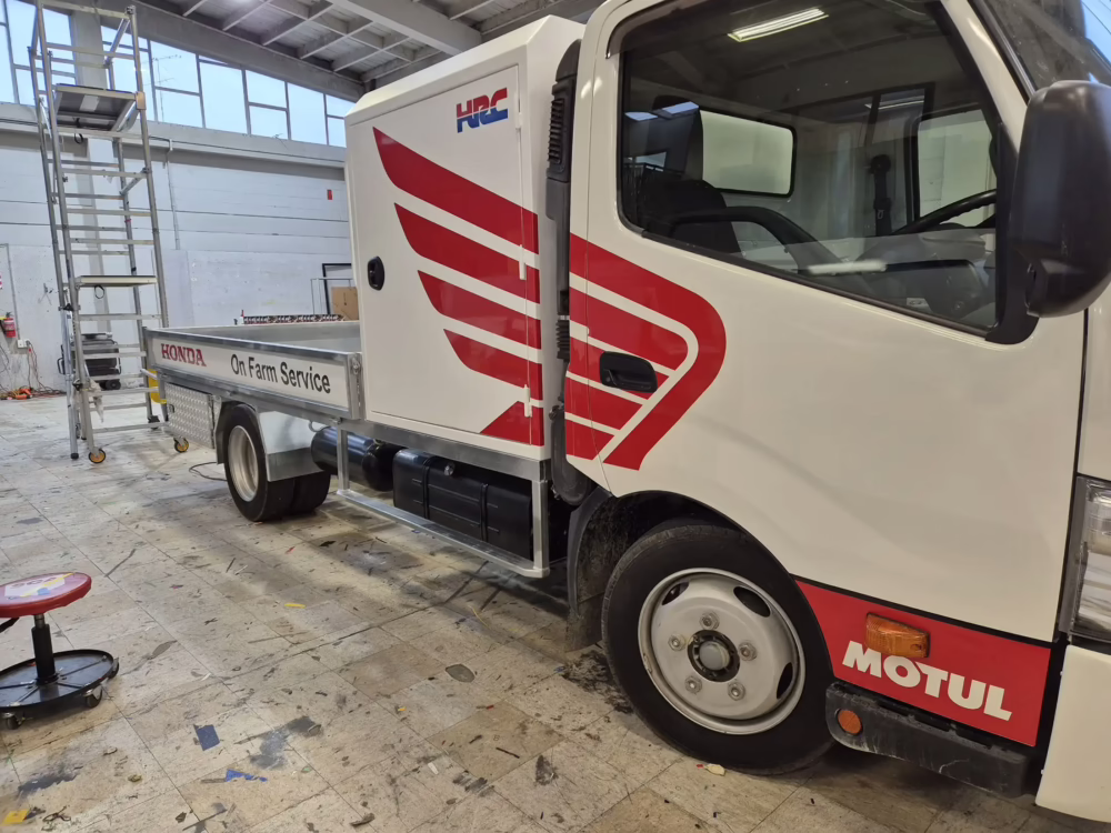 Custom red and white Honda HRC graphics and branding on a Timaru Honda On Farm Service truck.