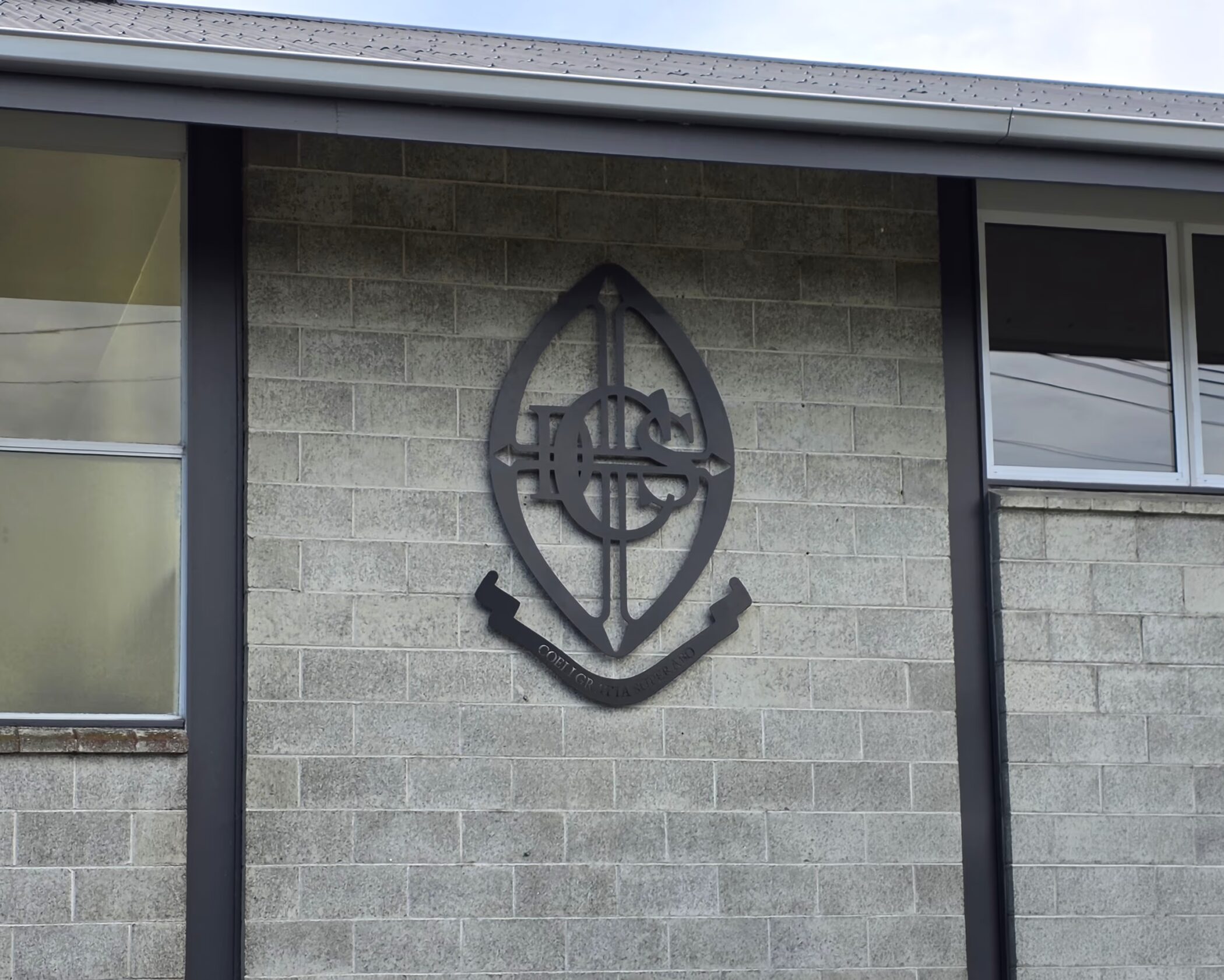 Signage for Craighead Diocesan School featuring the school name and coat of arms crest.