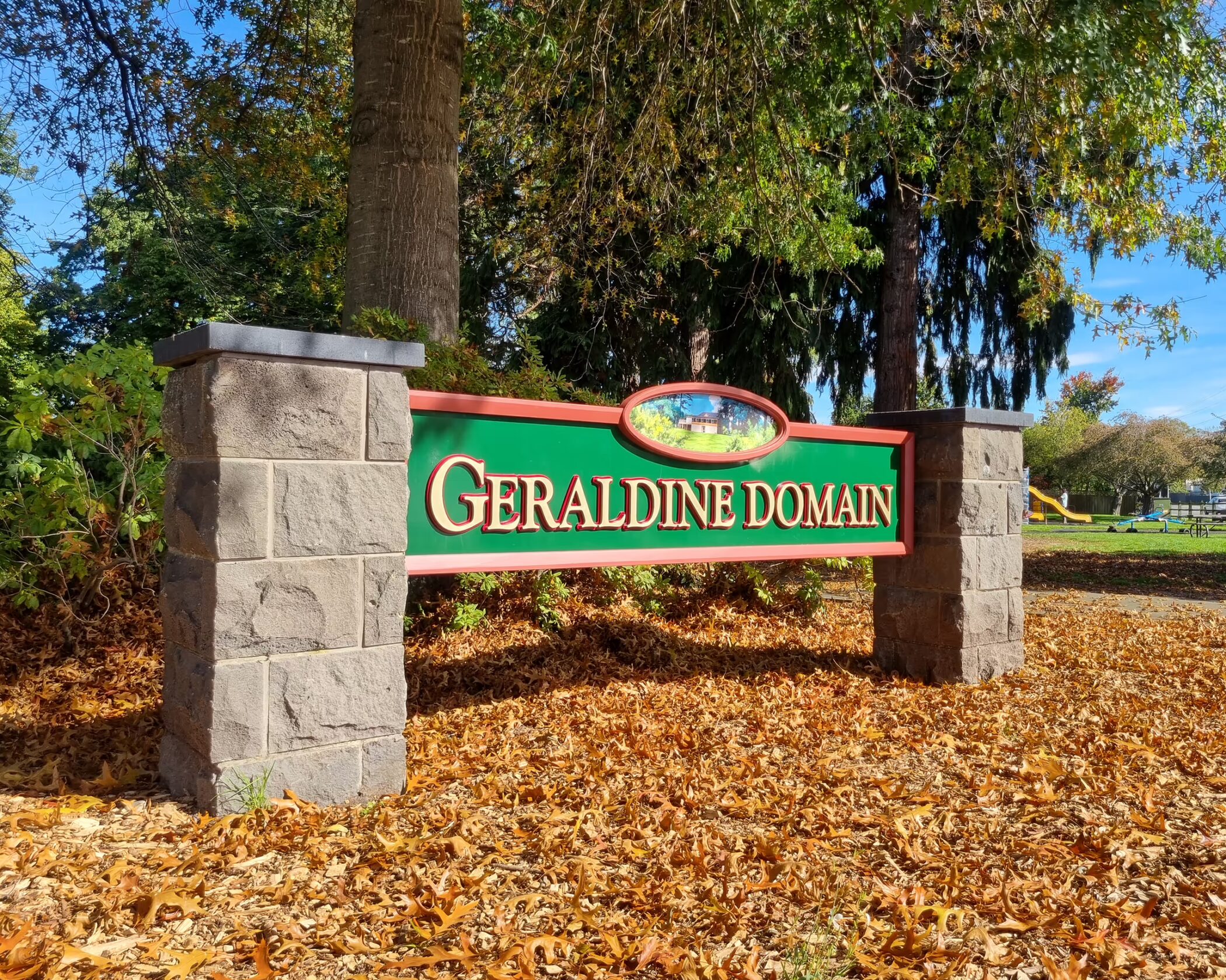 Freestanding sign by Timaru Signs Graphix at Geraldine Domain, featuring stone pillars and custom green branding.