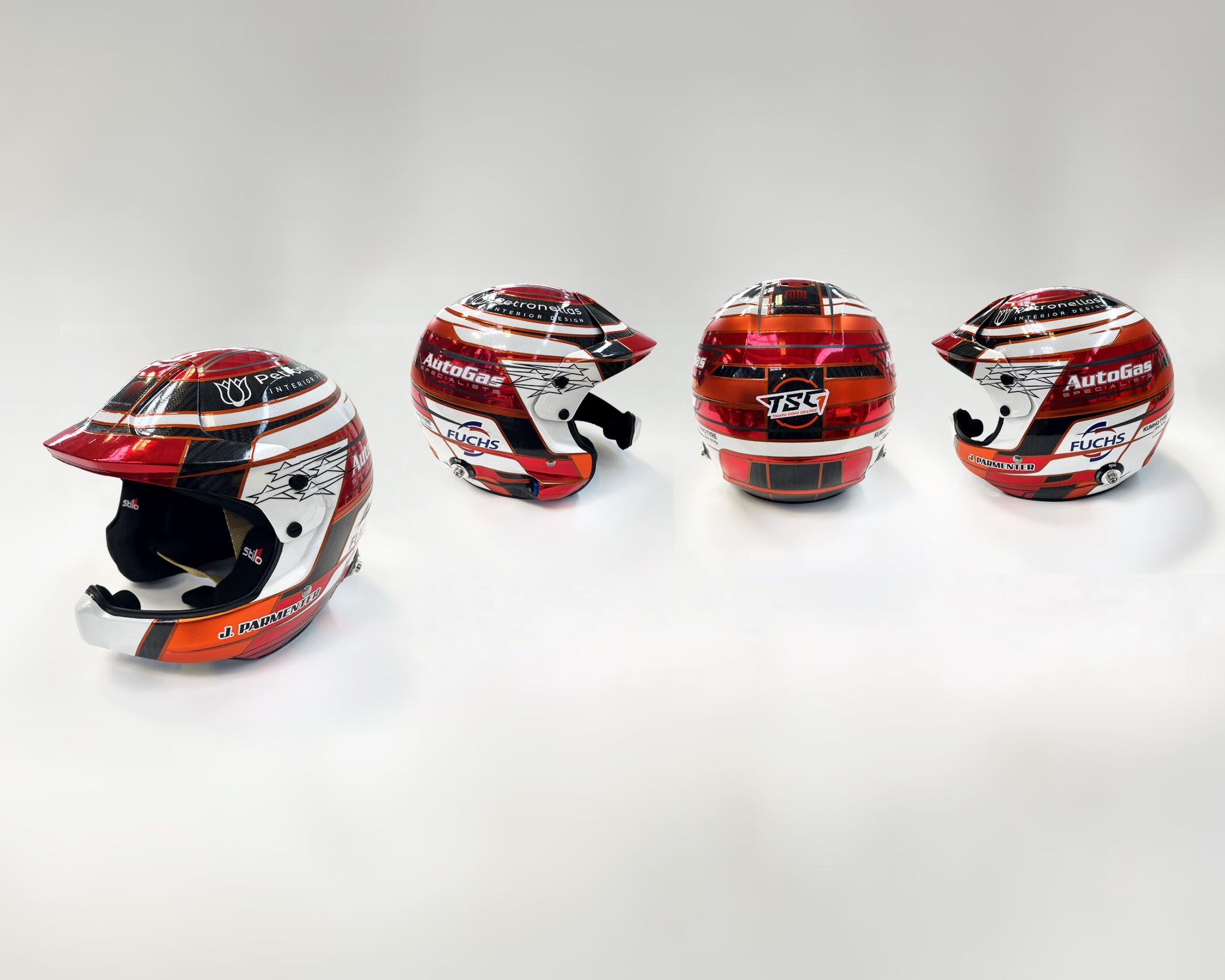 Custom motorsport helmet with a professional red, white, and chrome design, and sponsors including AutoGas, Fuchs, and TSG.