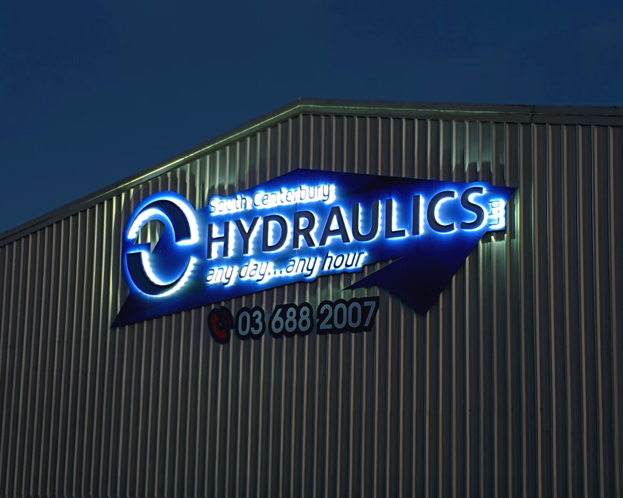 Illuminated LED fascia building sign for South Canterbury Hydraulics in Timaru, featuring blue backlighting and custom text.