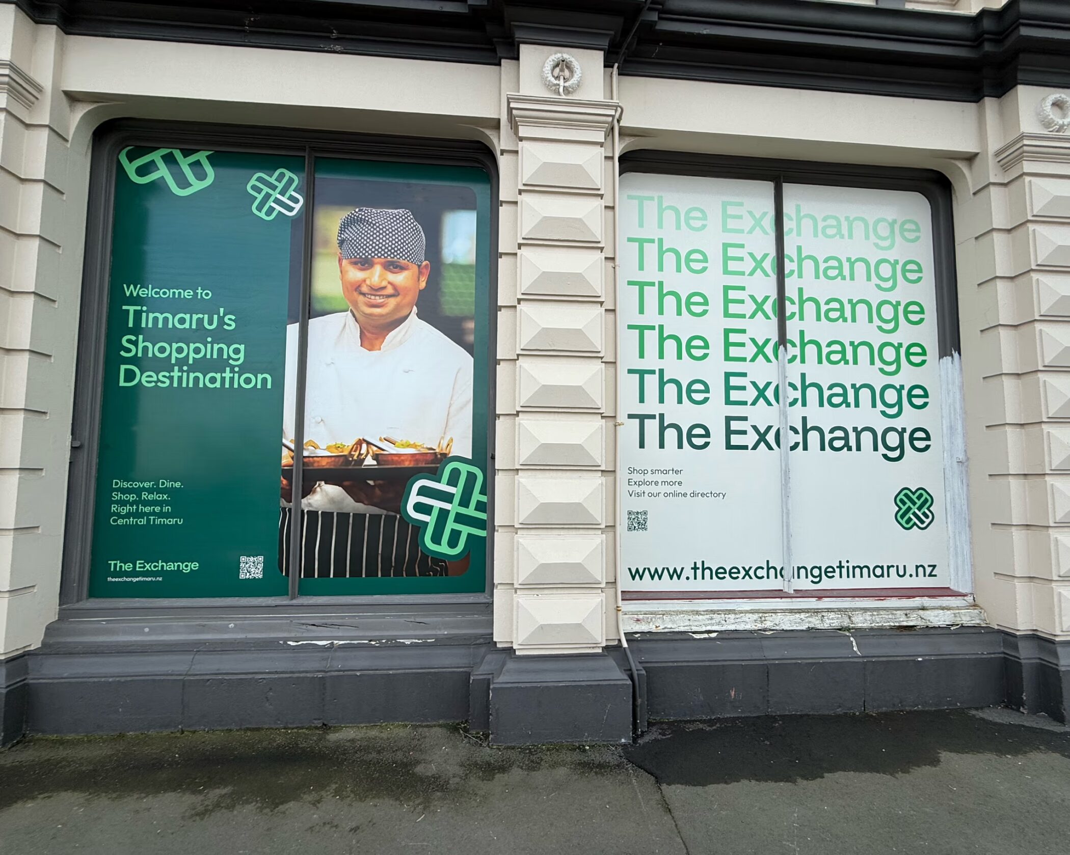 Custom green and white vinyl window graphics installed on The Exchange storefront in Timaru.